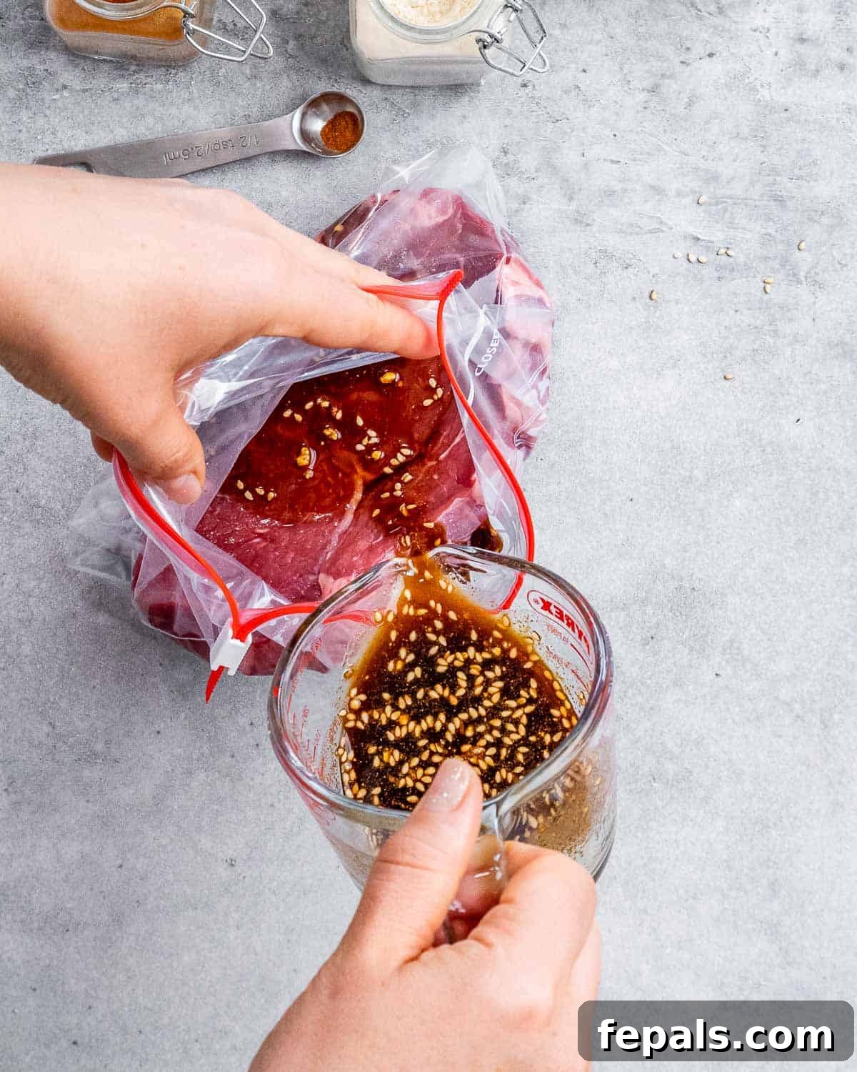 Sweet and Savory Teriyaki Steak 6 Pouring marinade into bag with steak.