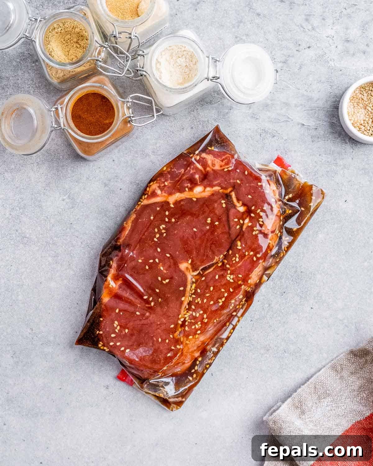 Sweet and Savory Teriyaki Steak 7 Steak marinating in a bag.