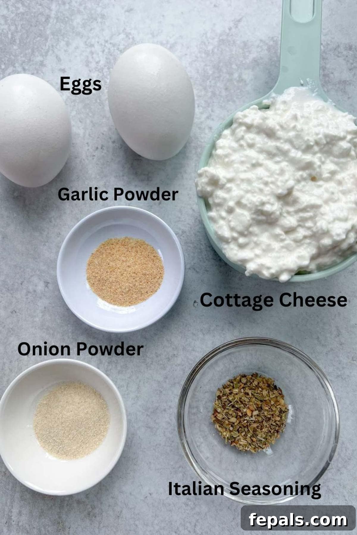 The Viral Cottage Cheese Wrap 3 ingredients to make cottage cheese wrap, including eggs, onion powder, garlic powder, Italian seasoning, and a bowl of cottage cheese.