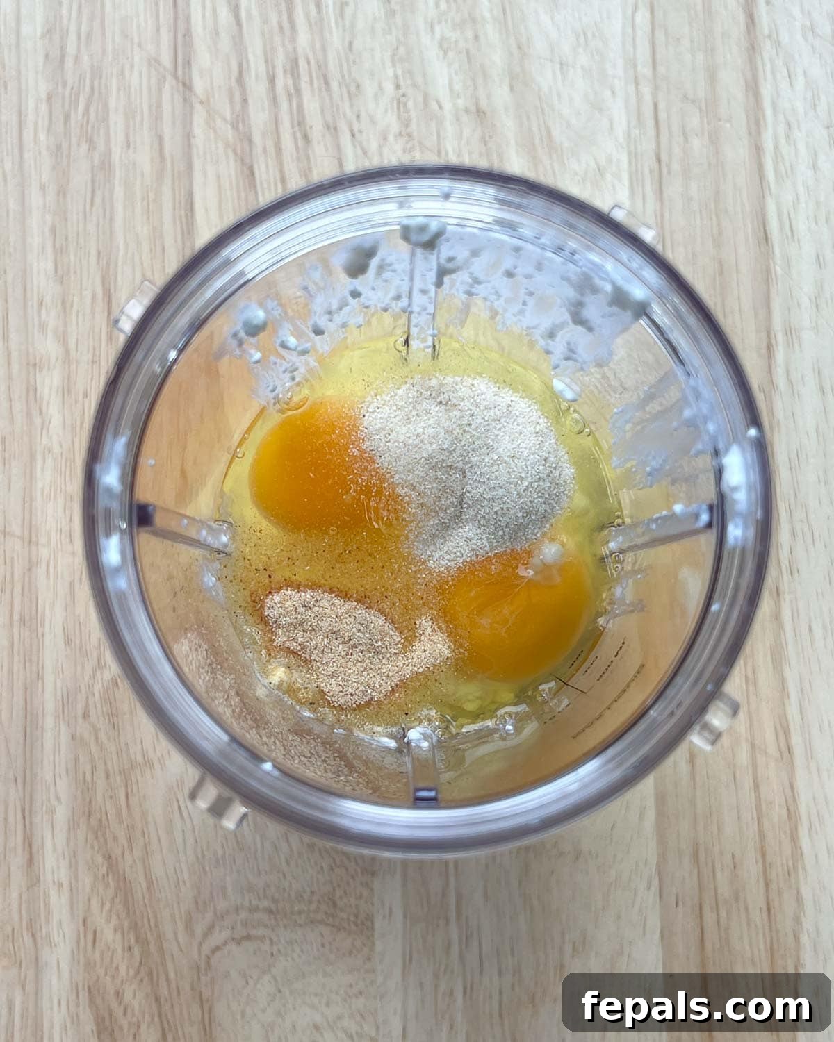 The Viral Cottage Cheese Wrap 4 cottage cheese, eggs, and seasonings are added to a blender cup.