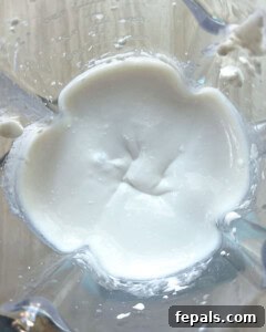 blended cottage cheese with maple syrup in a blender.