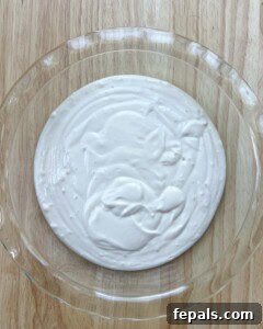 blended cottage cheese is added to a round deep dish.