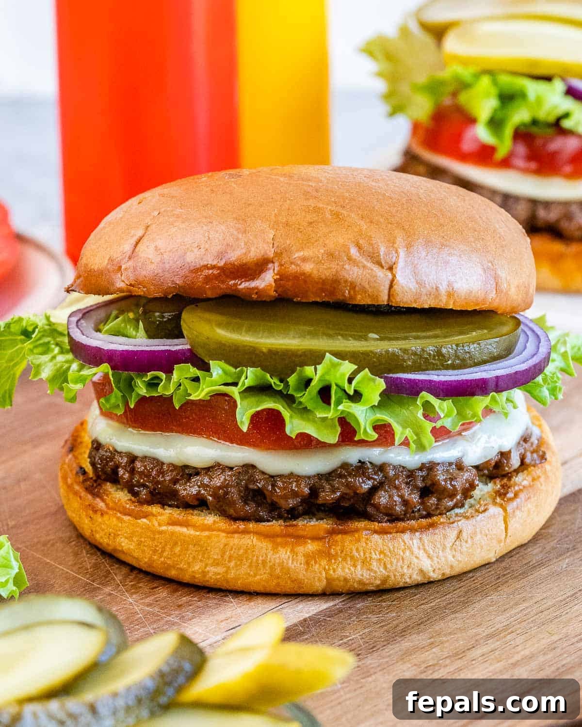 Burger Perfection, Made Easy 2 A homemade hamburger with lettuce, tomato, onion and pickles.