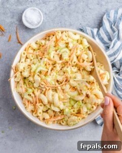 Aloha Macaroni Salad 15 A large bowl of completed mac salad with vibrant colors and creamy texture, perfect for a family meal.