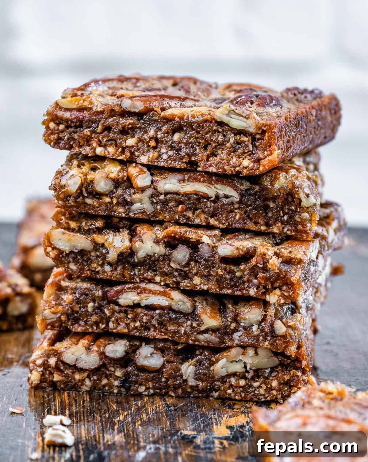 Healthy pecan pie bars stacked.