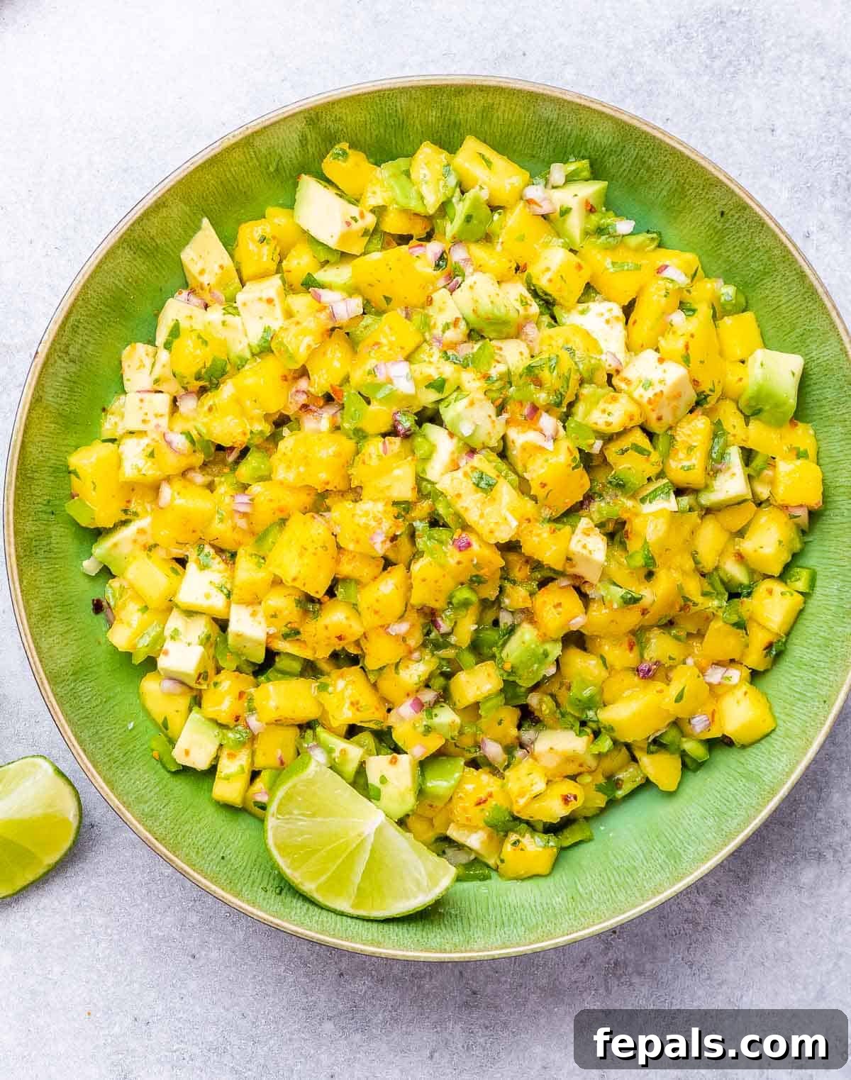 A beautiful bowl of fresh mango salsa, ready to be served.