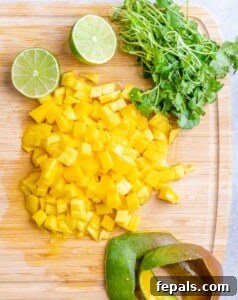 chopped mango on a cutting board.