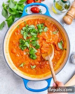 Fresh and Fast Tomato Basil Pasta 14 Tomato basil sauce cooking in skillet with fresh basil.