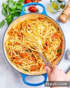 Fresh and Fast Tomato Basil Pasta 15 Spaghetti and tomato basil sauce fully combined in the skillet, with flecks of fresh basil.