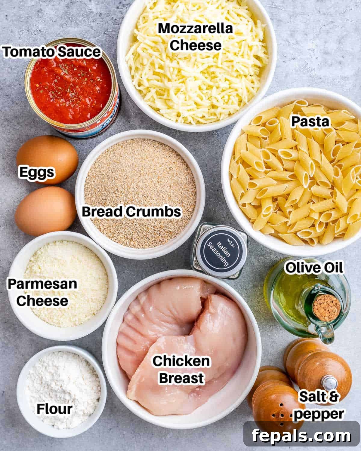 Ultimate Chicken Parm Bake 3 Ingredients for chicken parmesan casserole laid out on a wooden surface.