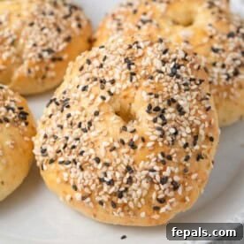 Protein Packed Cottage Cheese Bagels Yeast Free 10 bagels on a plate topped with everything but the bagel seasoning.