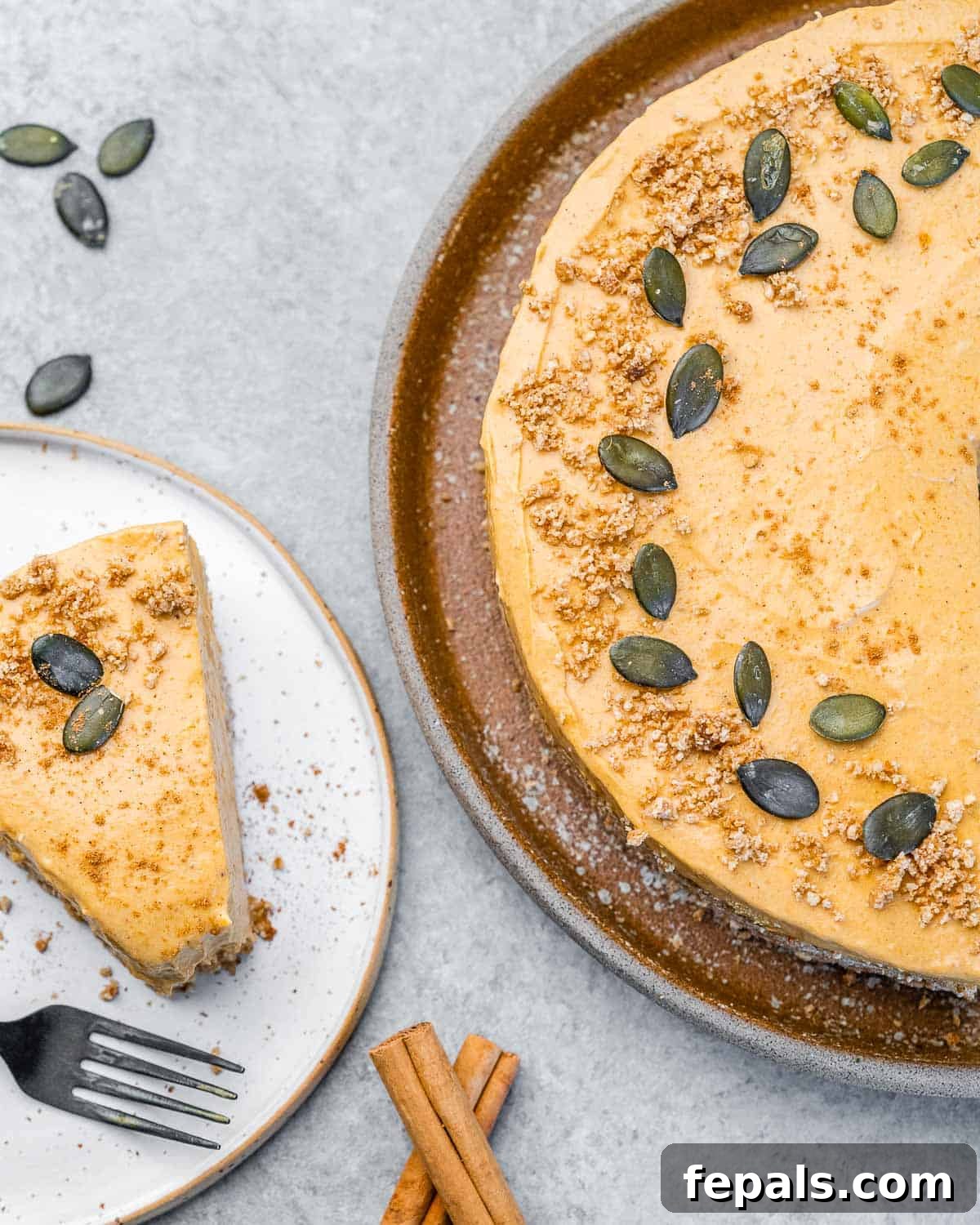 No bake pumpkin cheesecake sliced and served on a white plate.