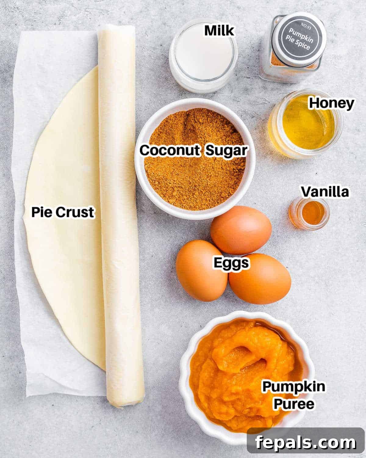 Wholesome Pumpkin Pie 3 A selection of fresh ingredients laid out on a surface, ready to be combined for making a healthy pumpkin pie.
