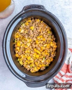 Easy Crockpot Chili 14 Sauteed browned meat and veggies are added to the crockpot.