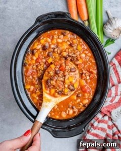 Easy Crockpot Chili 16 Stirring crockpot chili recipe in a slow cooker.