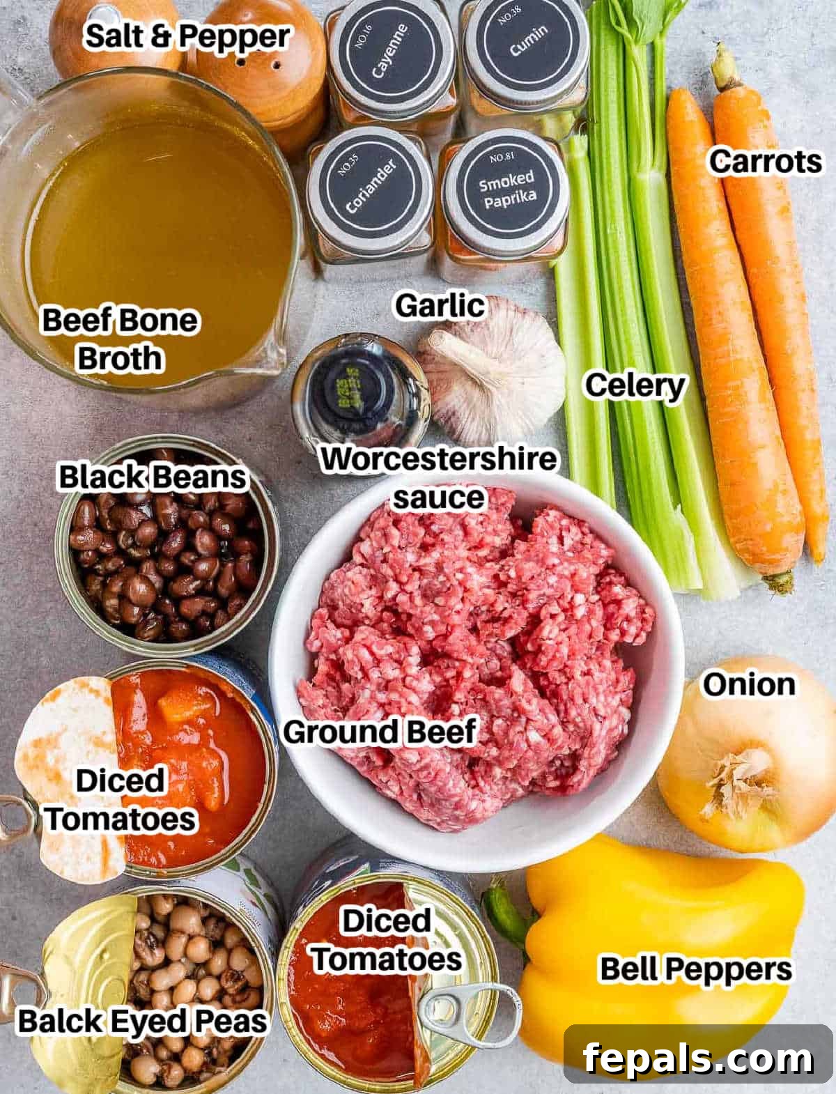 Easy Crockpot Chili 3 A vibrant display of fresh ingredients for making crockpot chili, including ground beef, spices, and chopped vegetables.