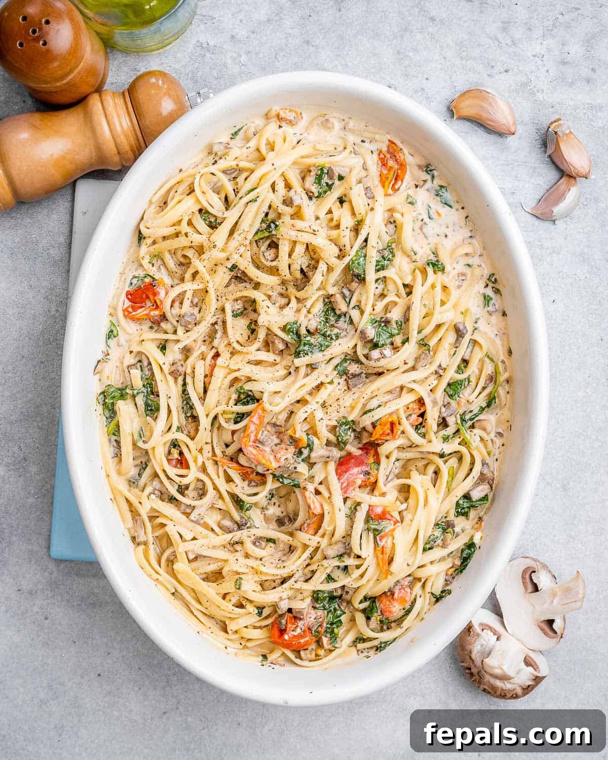 Blush Tomato Cream Pasta 2 Creamy tomato pasta bake in a white oval dish, ready to be served.
