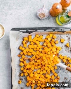 Velvety Butternut Mac and Cheese 4 Roasted cubed butternut squash on a sheet pan.