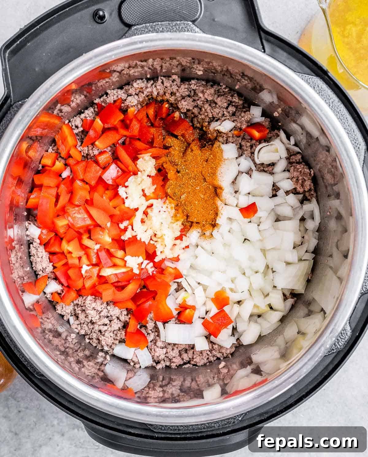 A pot with vegetables and spices.