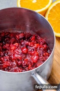 cooked cranberry sauce in pot.
