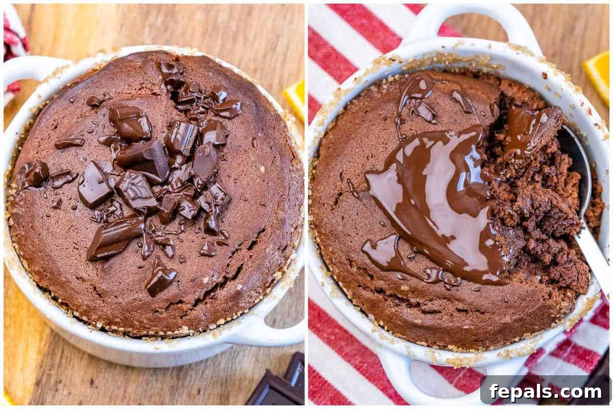 A tray of beautifully risen chocolate soufflés fresh from the oven, with one ramekin ready for a sprinkle of chocolate shavings.