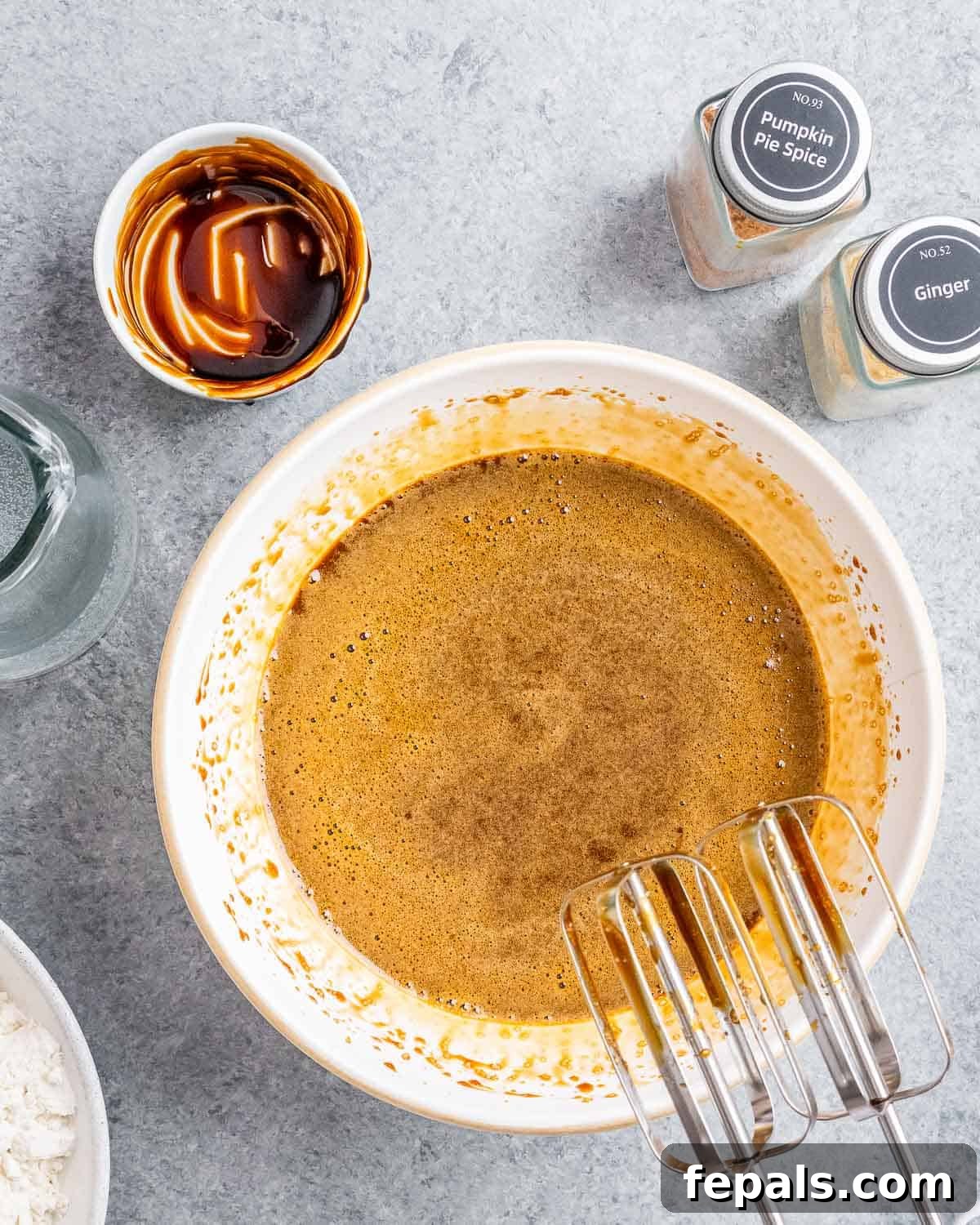 eggs molasses, and oil, mixed in a bowl.