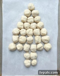 dough before baking placed on a sheet pan in a tree-like manner.