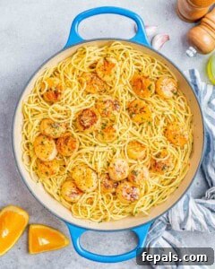 Pasta and scallops tossed together in the pan, just before serving.