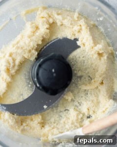 Fluffy Lebanese Garlic Dip 18 blended garlic in food processor.