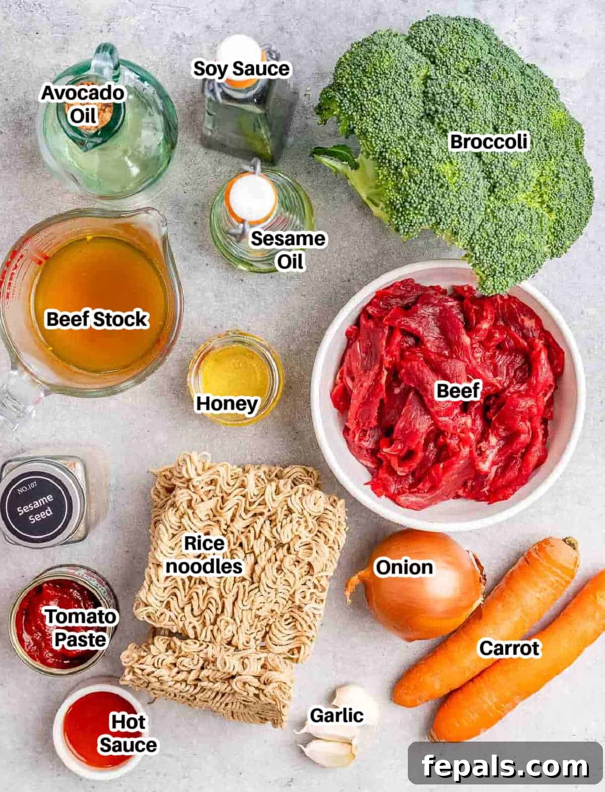 Wok-Tossed Beef Noodles 4 A flat lay photograph showing all the ingredients required to make beef lo mein, including noodles, beef, various vegetables, and sauce components.