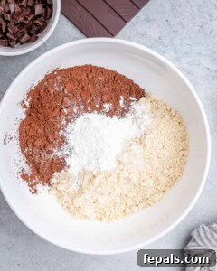 Fudgy Almond Flour Brownies 13 almond flour, cocoa powder, and corn starch added to a bowl.
