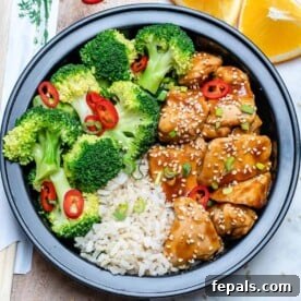 Two vibrant Teriyaki chicken bowls, showcasing tender chicken, colorful vegetables, and a glossy sauce, ready for a delicious meal.