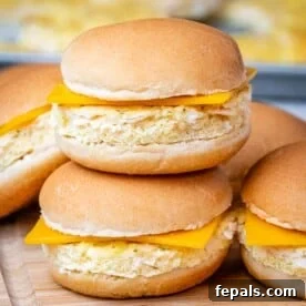 Two perfectly stacked breakfast sandwiches, ready to grab and go for a quick breakfast.