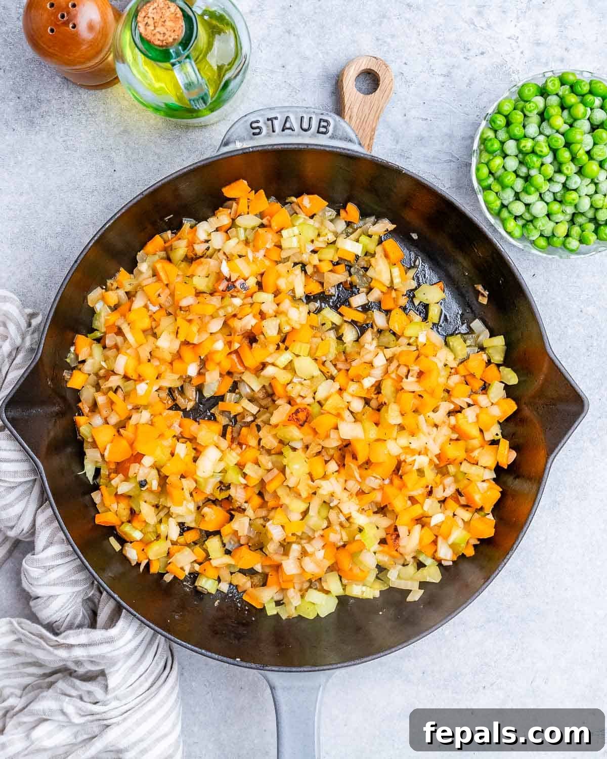 Homestyle Beef Shepherd's Delight 4 Cooked vegetables in a black skillet.