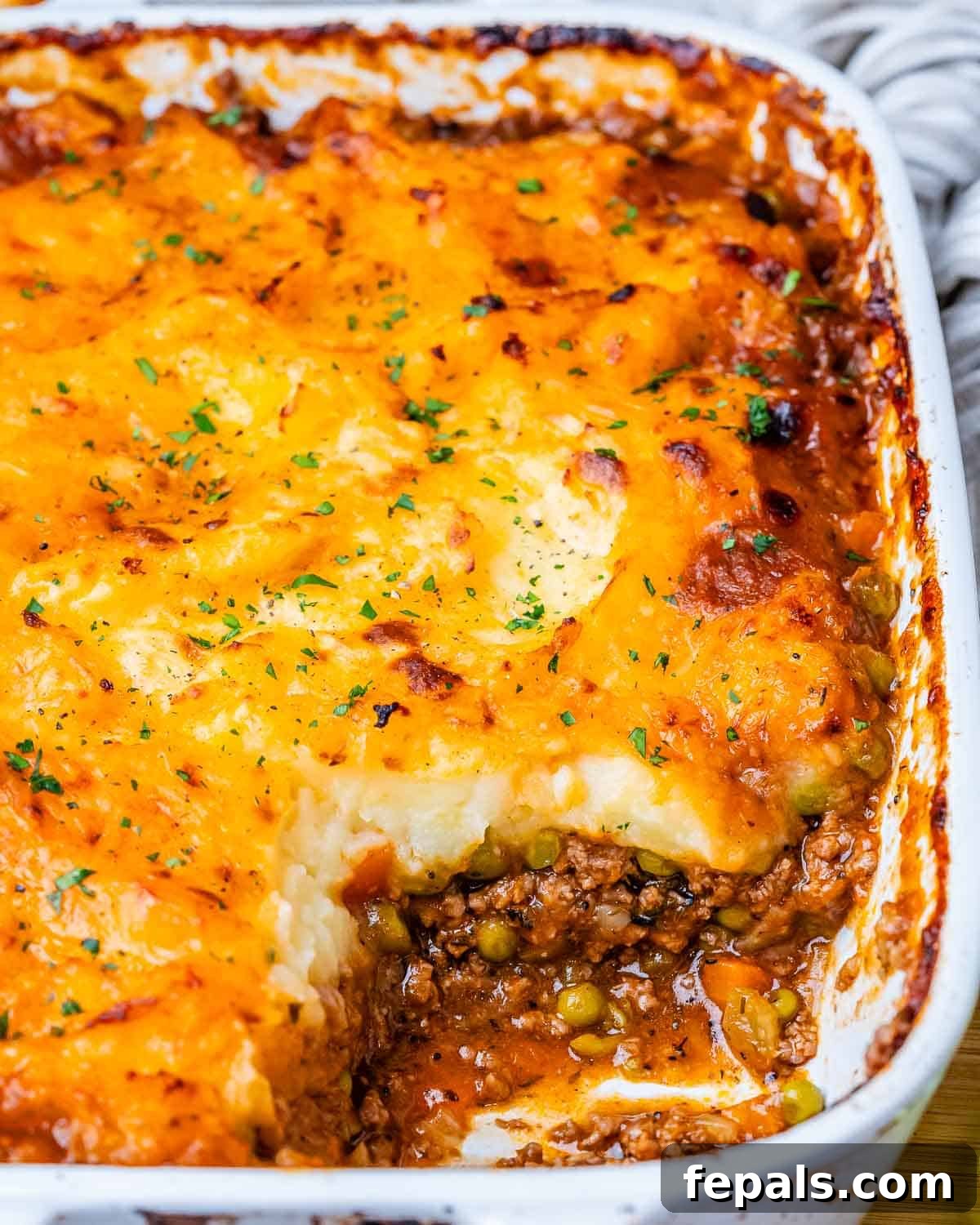 Homestyle Beef Shepherd's Delight 9 Baked casserole in a white dish.