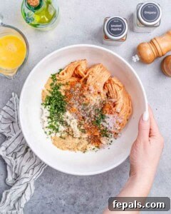 A white bowl with meatball ingredients.