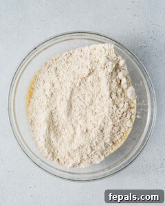 almond flour added over the banana egg mixture.