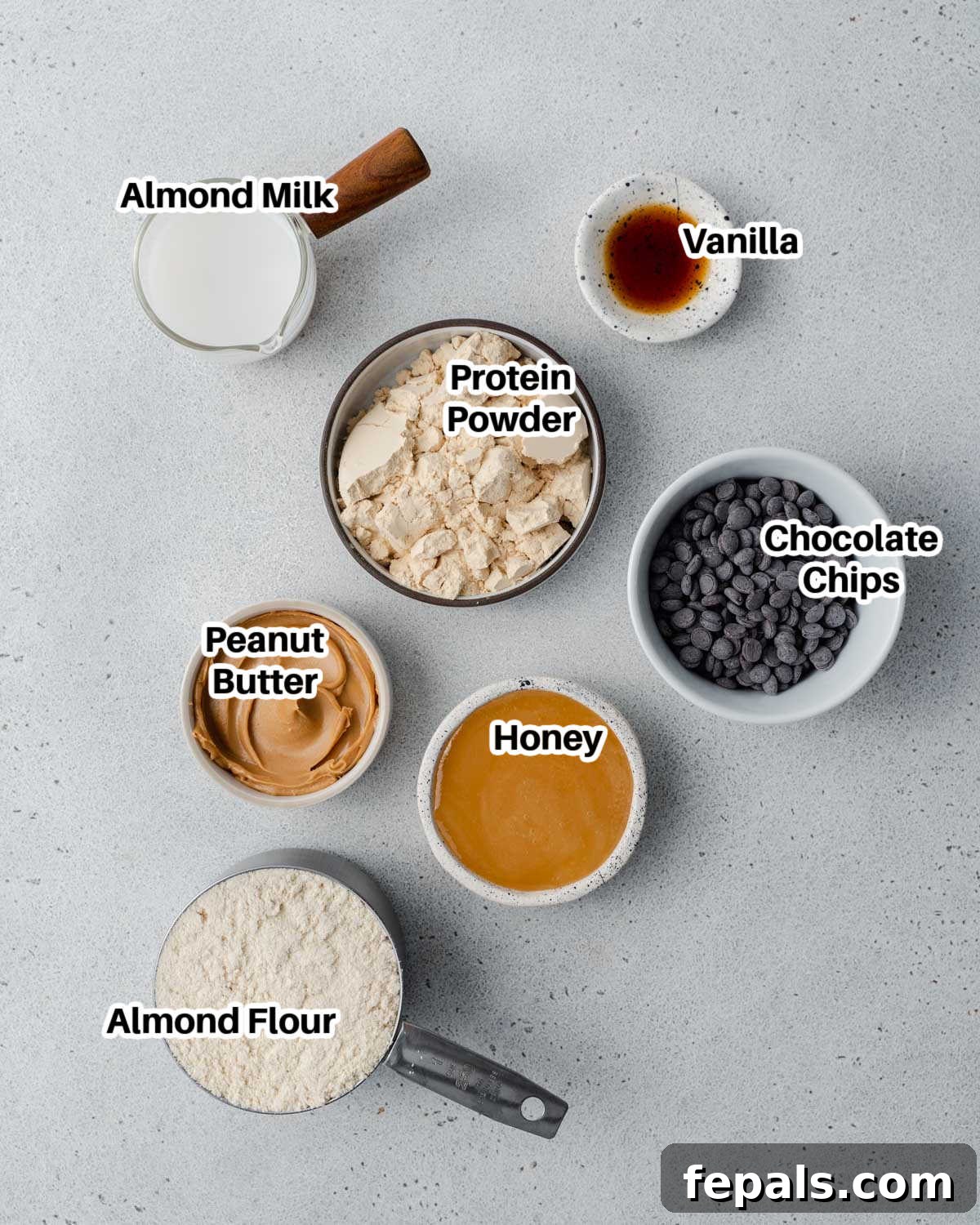 Guilt-Free Protein Cookie Dough 3 All the fresh ingredients laid out on a clean surface, ready to make edible cookie dough.