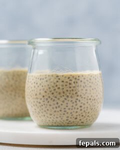 a cup half-ful with chia pudding.