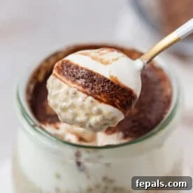 a spoonful of chia pudding with a hint of cocoa powder.