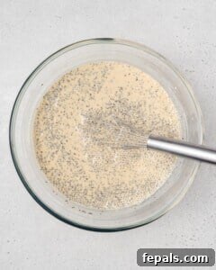 Whisking chia pudding mixture in a bowl.
