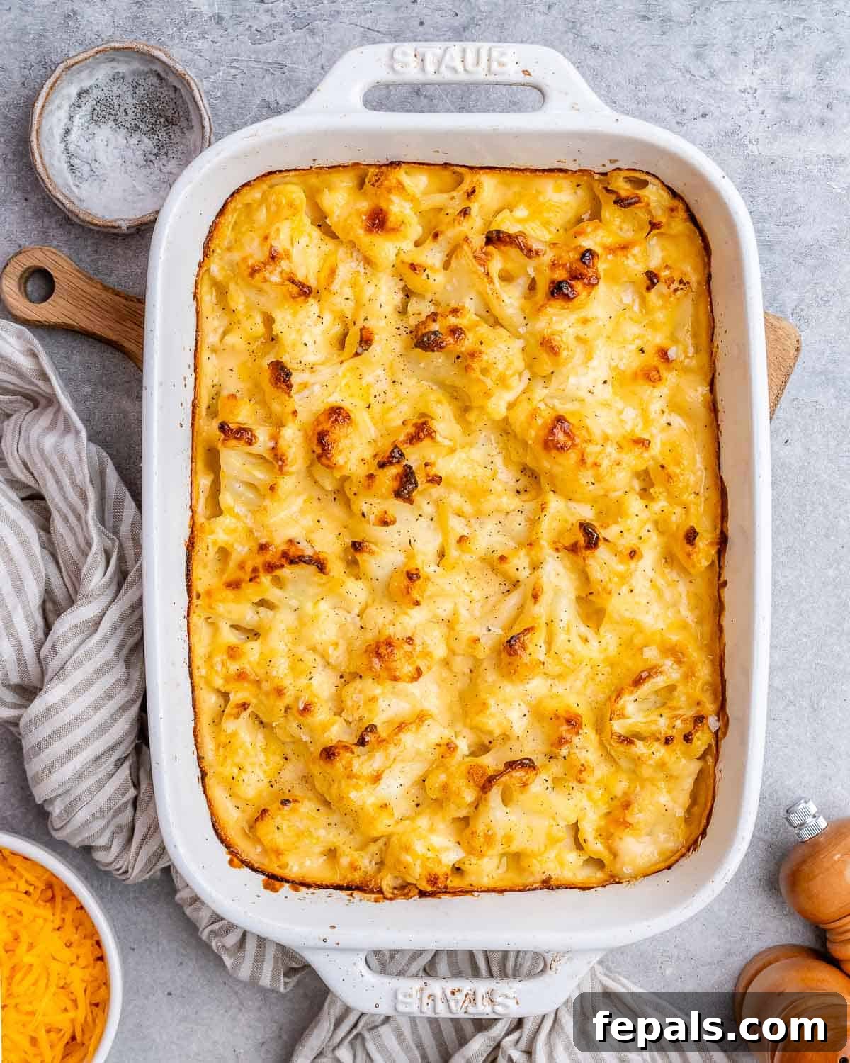 Mac and cheese with cauliflower in a white dish.