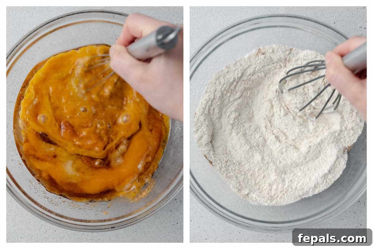 Process shot showing the mixing of pumpkin puree and other wet ingredients in a large bowl, with a whisk nearby, ready for combination.