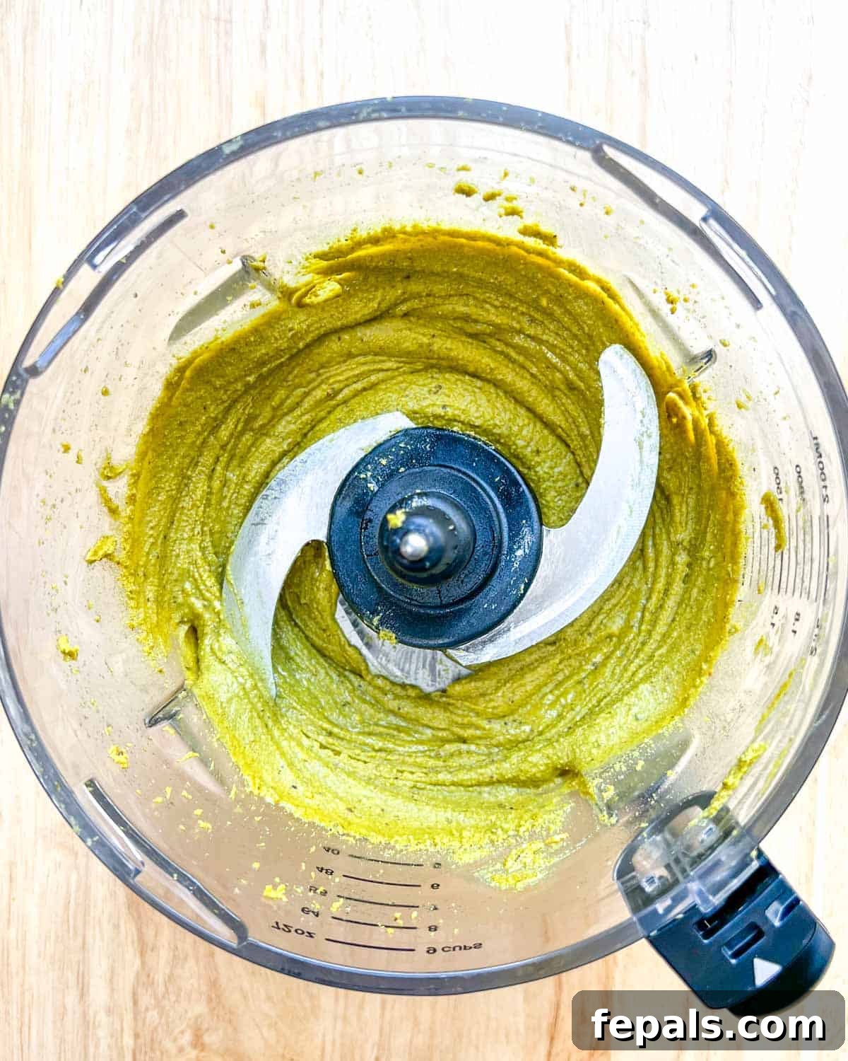 Decadent Pistachio Cream 8 The fully blended pistachio cream showing a smooth, creamy texture inside the blender.