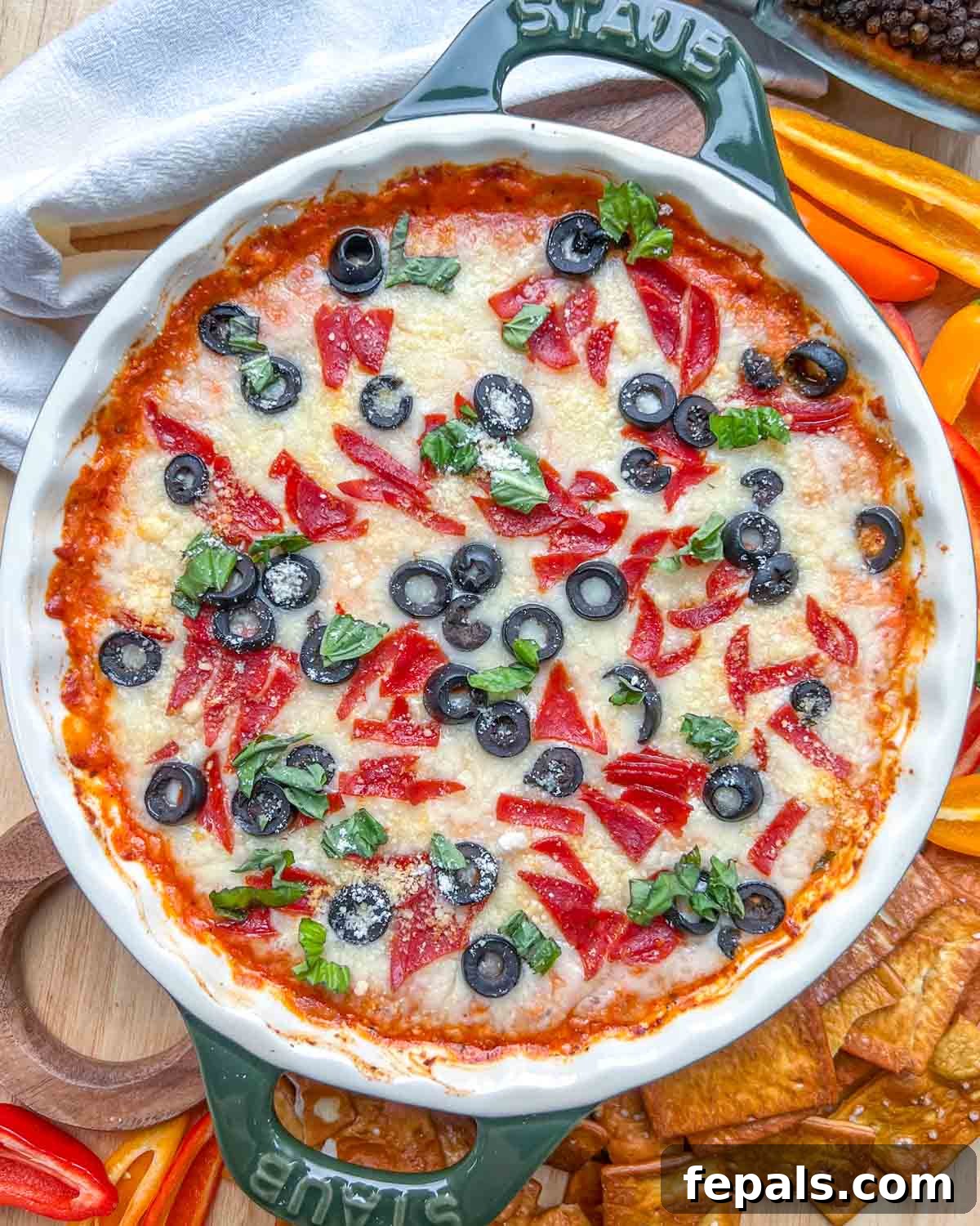 Crustless Pizza Cottage Bowl 2 a round dish with cottage cheese baked pizza bowl, topped with pepperoni, olives, and fresh basil.