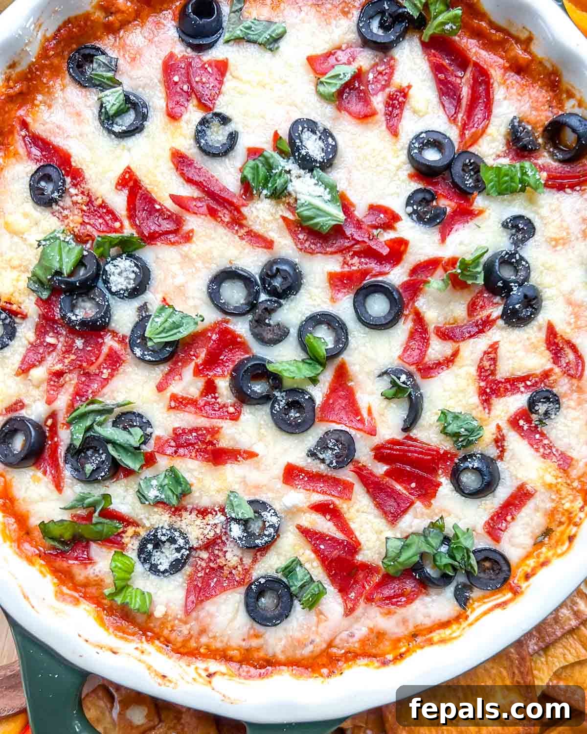 Crustless Pizza Cottage Bowl 11 baked cottage cheese crustless pizza in a bowl topped with black olives, and chopped fresh basil.