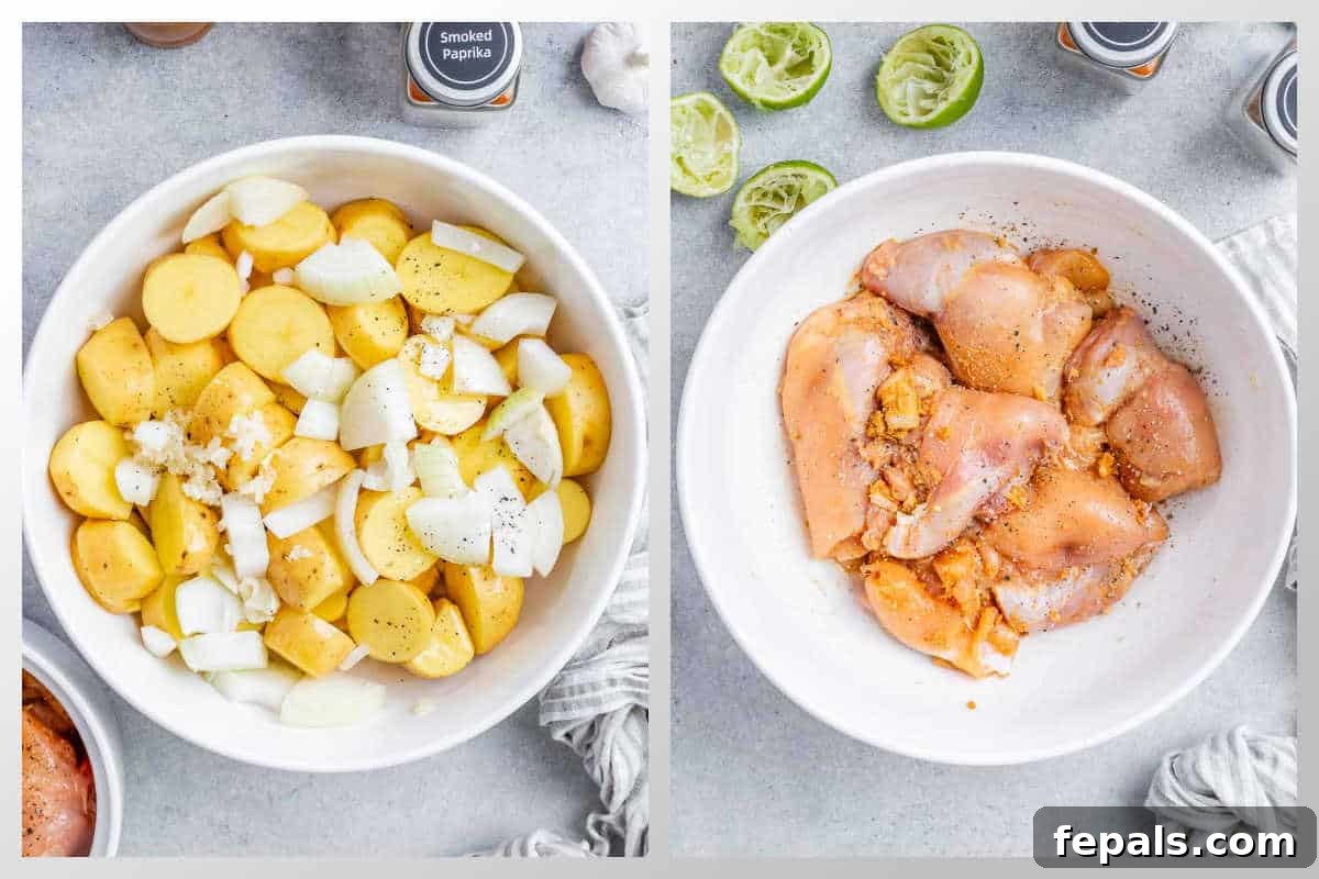 Process shot showing chopped baby potatoes and seasoned chicken thighs in a large mixing bowl, ready for coating.