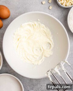 Tropical Coconut Bliss Cake 14 Whipped base batter in a mixing bowl after creaming butter, coconut oil, and sugar.