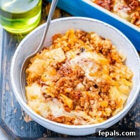 Easy Cabbage Roll Bake 8 a bowl with cabbage roll casserole with rice and ground beef.