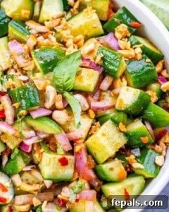 close up of Thai cucumber salad in a white bowl